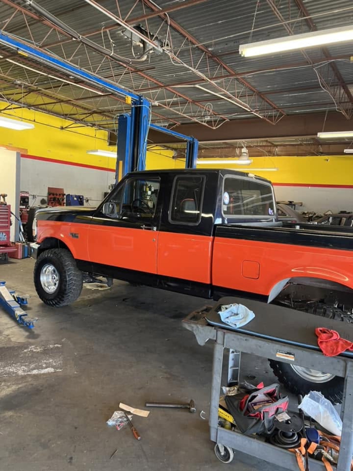 Truck being serviced inside the All N 1 Car Care shop